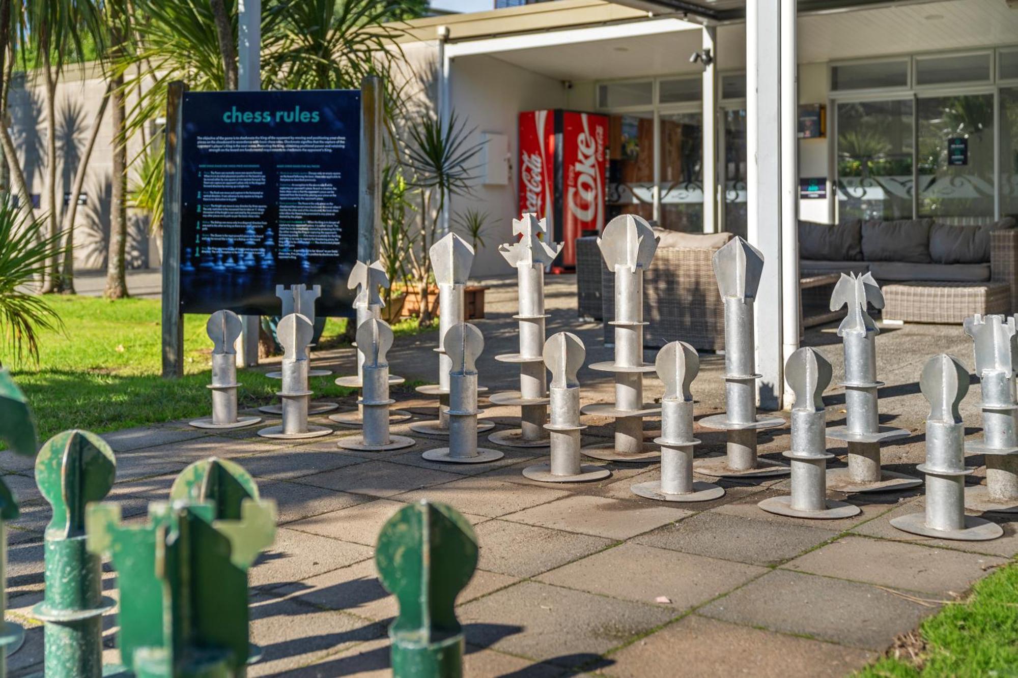 Tasman Holiday Parks - Waihi Beach Exterior photo Chess set at the entrance of the library